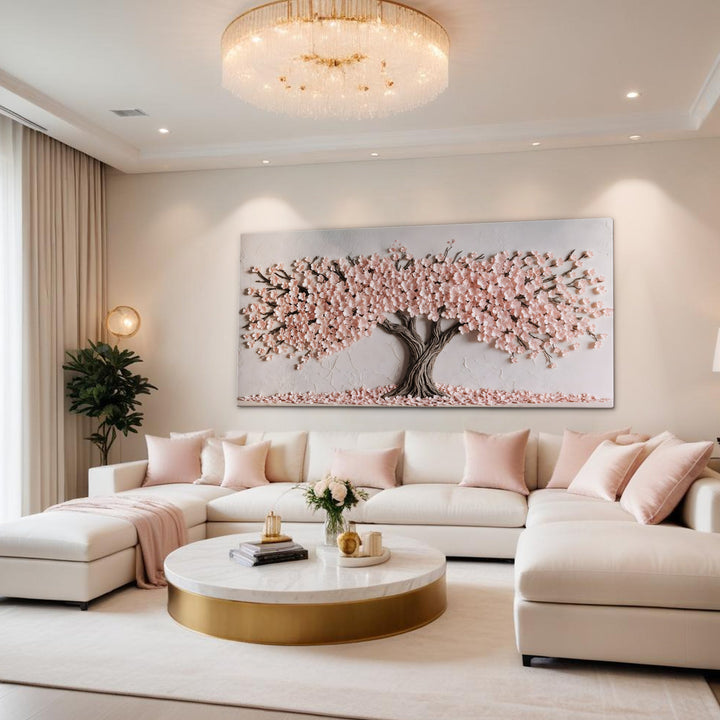 Quadro Cerejeira em Flor acima de sofá em L branco com almofadas rosadas e lustre de cristal